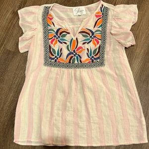 Great top for summer or spring. Very fun colors and patterns.